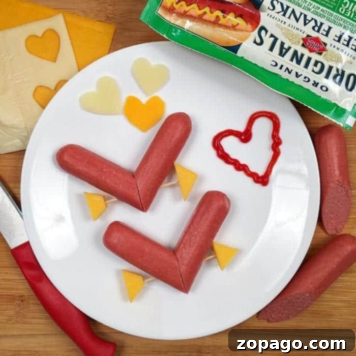 Valentine dinner idea to do for your kids here is a great one that is inexpensive and they will love. Valentine craft for kids Family enjoying a cute Valentine dinner idea with heart hot dogs and festive decorations