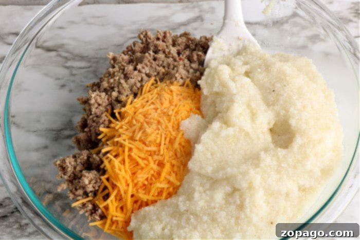 Cheesy Grits Bake 4 Close-up of creamy grits and cheese, ready for the casserole.