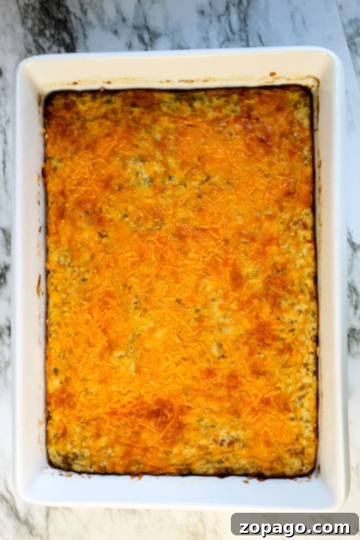 Cheesy Grits Bake 5 Bacon and Cheese Grits Casserole baked to golden perfection in a pan.