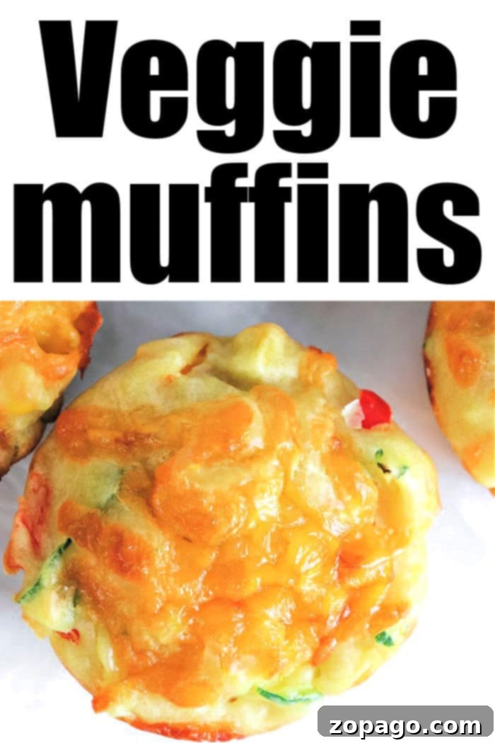 Irresistible Savory Zucchini Muffins 8 A close-up shot of a savory zucchini muffin, showcasing its golden crust and delicious, visible vegetable pieces within.