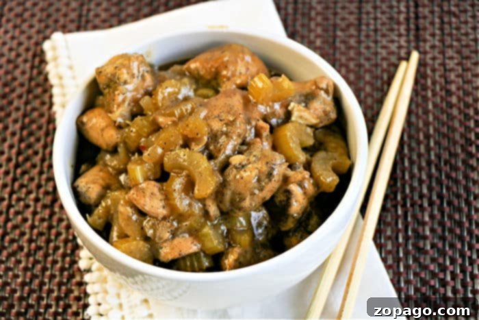 Instant Pot Black Pepper Chicken served with white rice and garnished.
