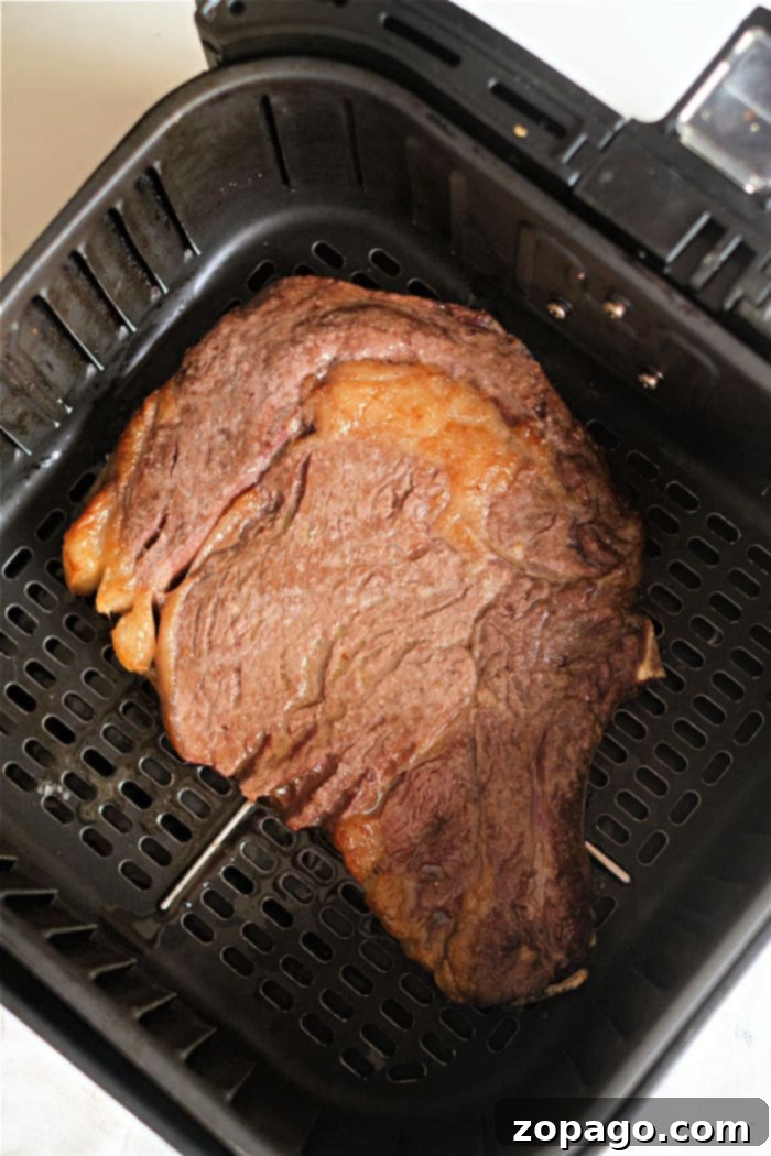 Perfect Air Fryer Ribeye 5 A delicious air fryer ribeye steak, sliced and ready to serve.