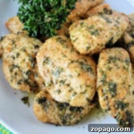 A plate of herb-crusted, air fryer boneless wings garnished with fresh parsley.
