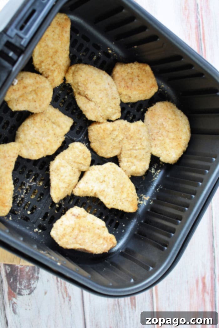 Crispy Air-Fried Chicken Bites 8 A serving of air fryer boneless chicken wings with dipping sauce and celery