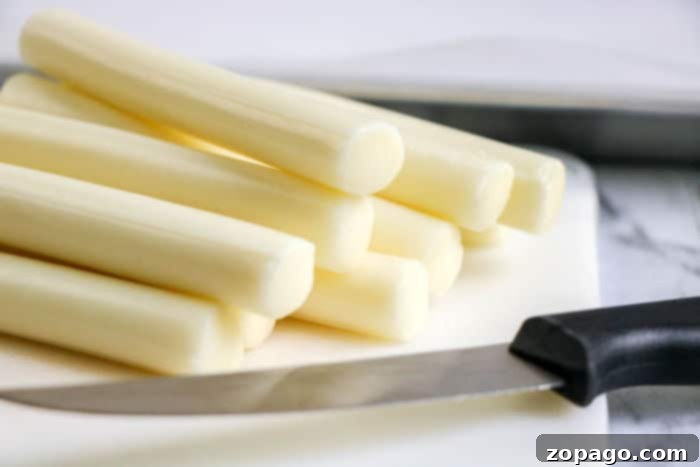 Crispy Air Fryer Mozzarella Sticks 6 Individual mozzarella string cheese sticks before preparation