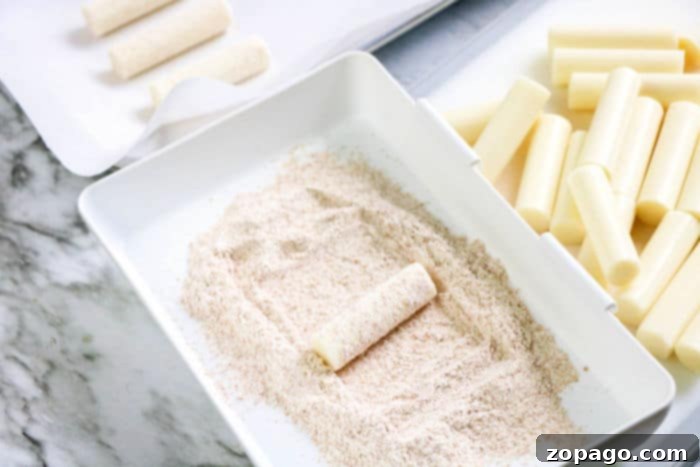 Crispy Air Fryer Mozzarella Sticks 7 A basket full of golden, crispy homemade air fryer mozzarella sticks