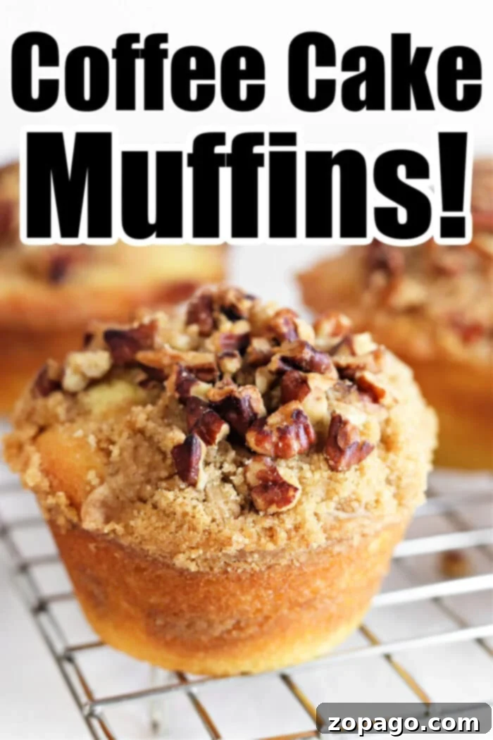 Ultimate Bakery Coffee Cake Muffins 9 A stack of perfectly baked Coffee Cake Muffins, showcasing their fluffy texture and crumbly streusel topping.