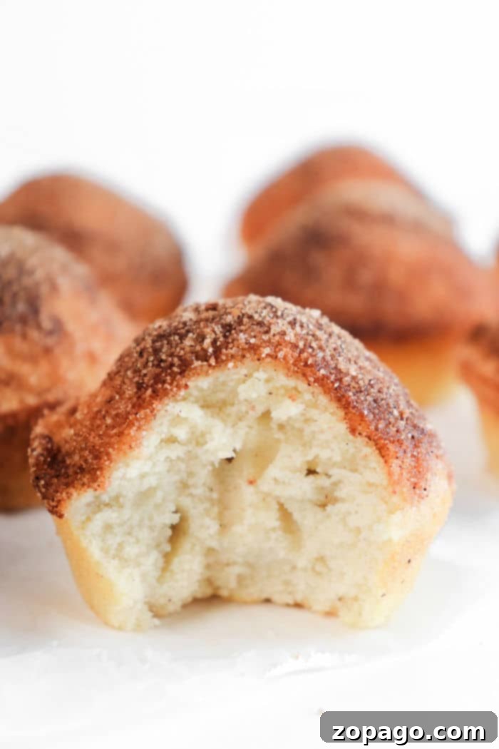 Donut Muffins 8 Stack of glazed donut muffins, glistening with a sweet coating.