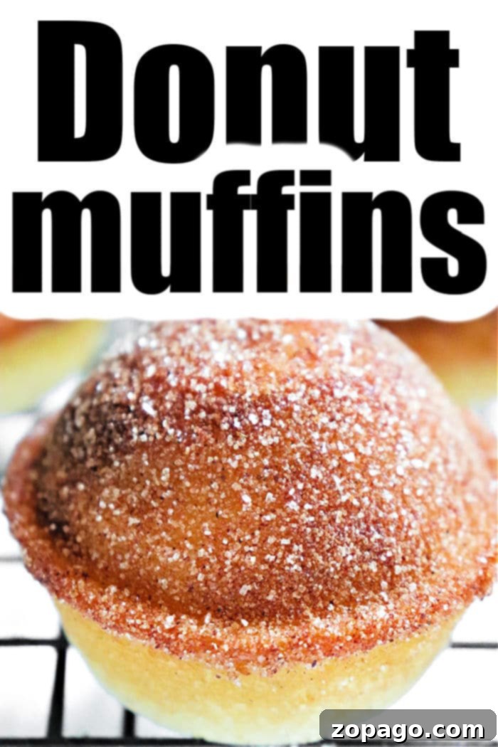 A stack of golden brown Donut Muffins, perfectly coated.