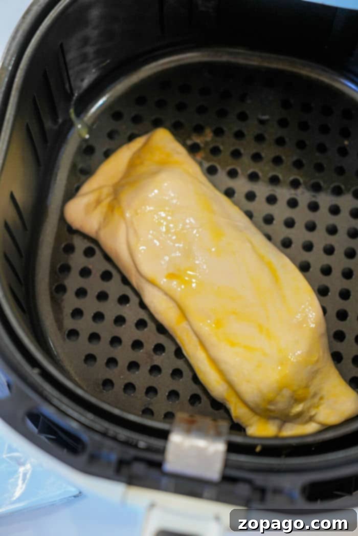 Air Fryer Beef Wellington Puffs 7 Homemade beef hot pocket made with Rhodes rolls, showing the sealed edges.