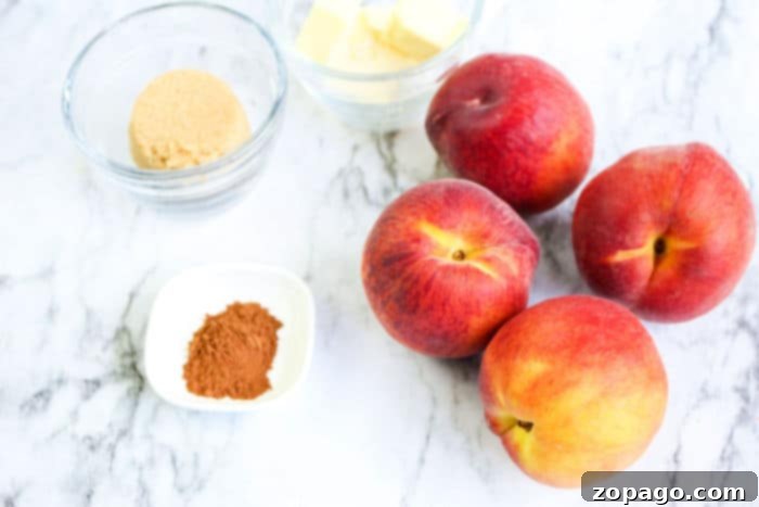Perfect Air Fryer Peaches 4 Halved peaches with a sweet filling cooking in an air fryer basket, showing their caramelizing edges.