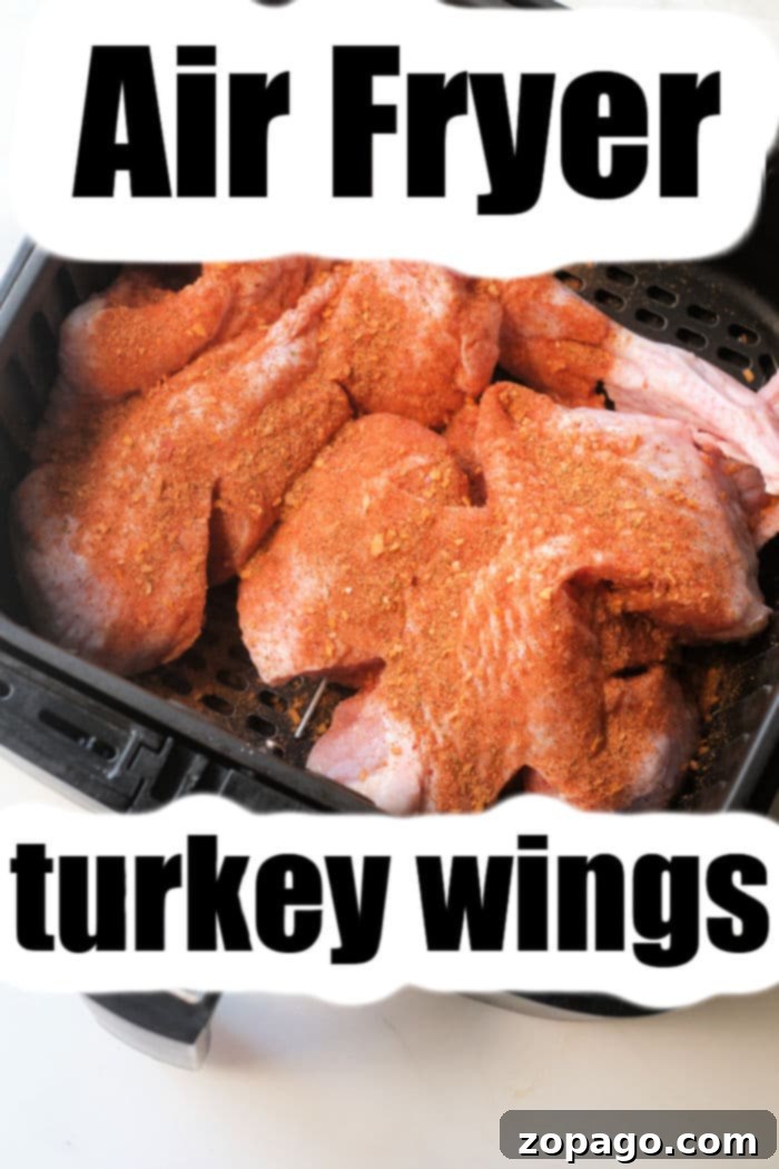 Crispy Air Fryer Turkey Wings 5 turkey wings in air fryer - Golden brown, crispy air fryer turkey wings perfectly cooked in a basket.