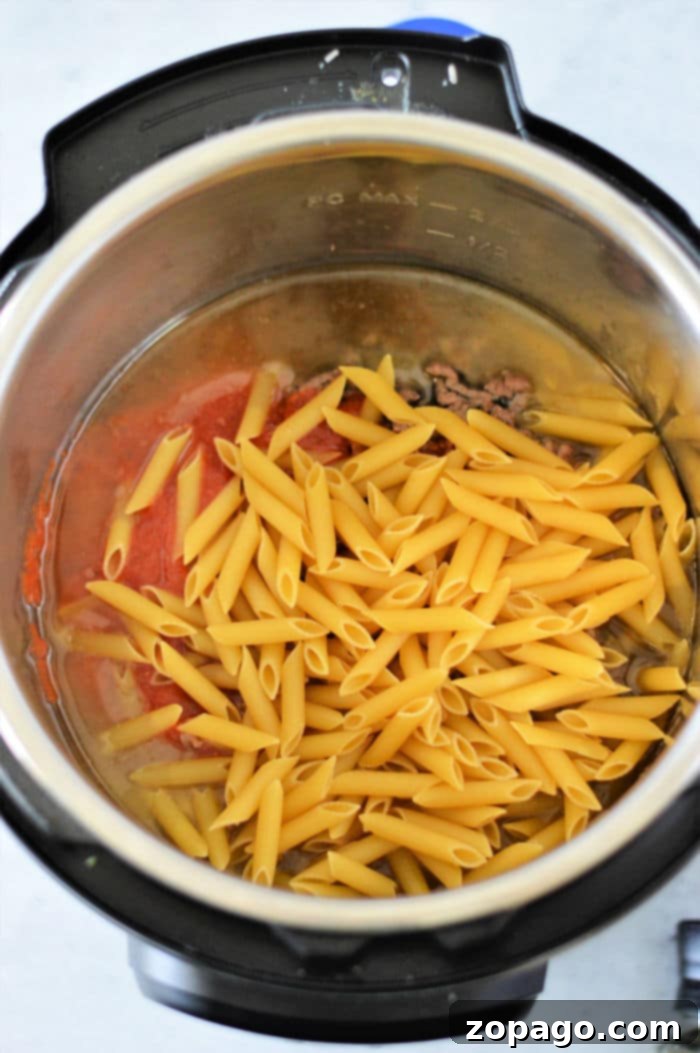 Easy Instant Pot Penne Pasta 4 Penne pasta cooking in the Instant Pot