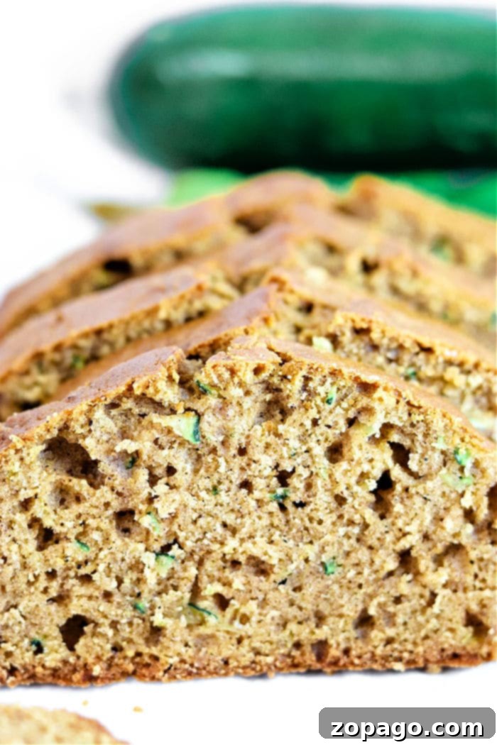 Spiced Zucchini Gingerbread Delight 6 Sliced Zucchini Gingerbread loaf, showing its moist and tender crumb texture