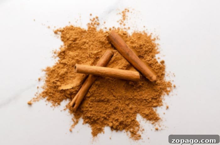 Close-up of a pile of ground cinnamon, a key ingredient in homemade gingerbread spice.