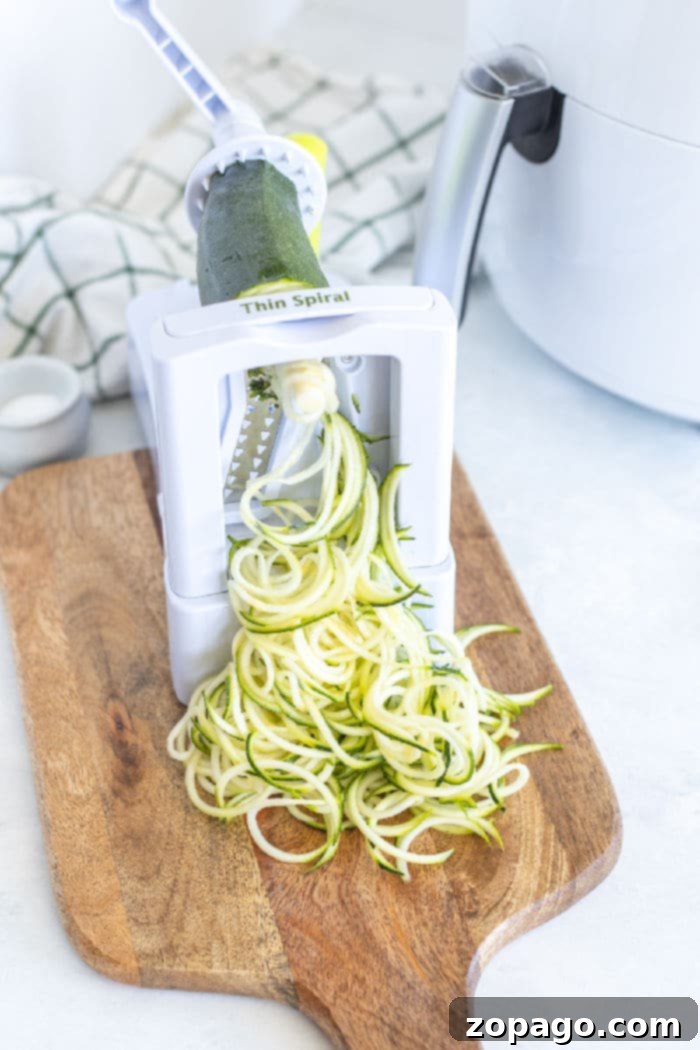 Crispy Air-Fried Zucchini Noodles 3 Freshly spiralized zucchini noodles ready for the air fryer
