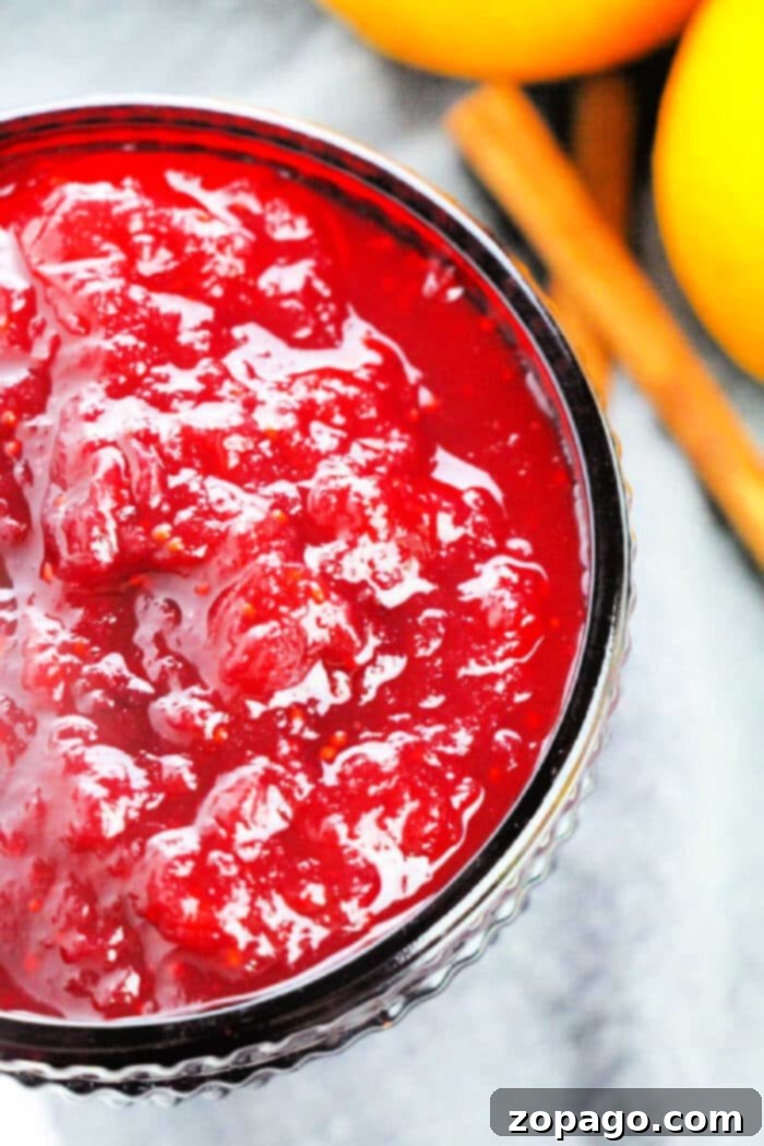 Classic Ocean Spray Cranberry Sauce 2 Vibrant orange juice cranberry sauce in a glass bowl.