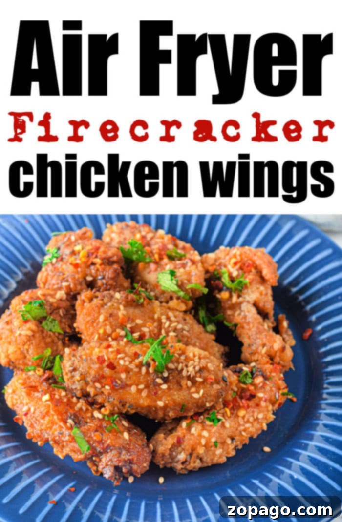 Dynamite Chicken 12 A vibrant platter of Firecracker Chicken Wings, perfectly sauced and garnished.