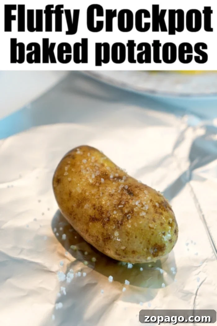 Easy Slow Cooker Baked Potatoes 4 Crockpot baked potatoes kept warm in a slow cooker, still wrapped in foil.