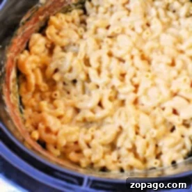 Crockpot Macaroni and Cheese with Evaporated Milk is a delightful dish, featuring creamy, melted cheese perfectly coating the pasta in a slow cooker.