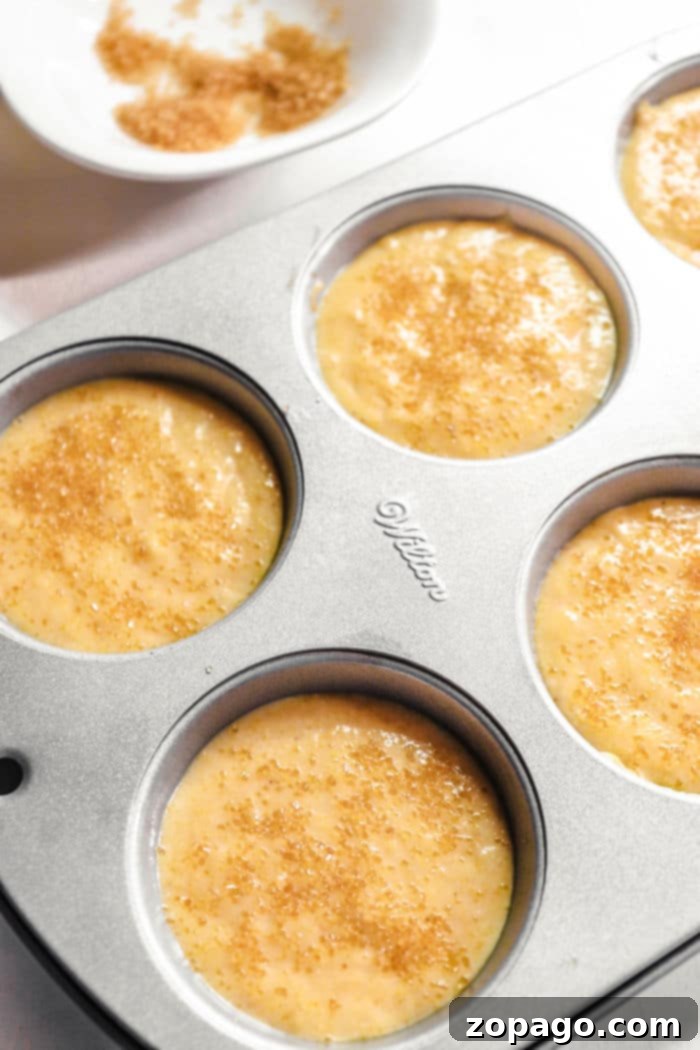 Golden Cornbread Muffins 4 Close-up of baked cornbread muffins in a tin, ready to be removed.