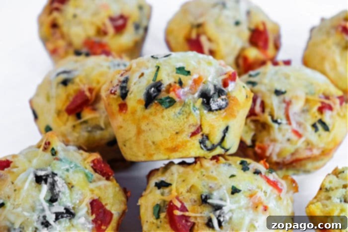 Muffin Tin Pizzas 7 Close-up of a single pizza muffin, showcasing its toppings and texture.