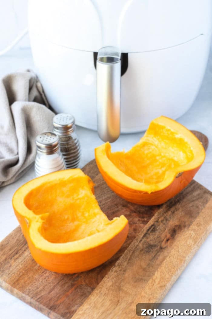 Crispy Air Fryer Pumpkin Fries 5 Sliced raw pumpkin pieces, ready for seasoning and air frying to create delicious air fryer pumpkins.