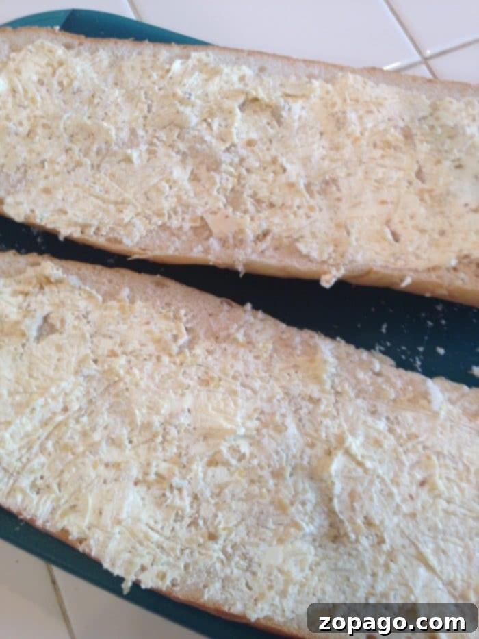 The best garlic bread recipe that is super easy and you can make it spicy too! The perfect side dish to spaghetti or meatloaf we say. Try our spicy cheese bread tonight! #garlicbread #spicy #cheesebread #bread #fiery #sidedish Delicious garlic bread with melted cheese, an irresistible side dish