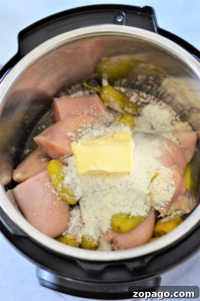Instant Pot Mississippi Chicken: Flavor Fast 5 Close-up of pepperoncini chicken in the Instant Pot, highlighting the vibrant peppers.