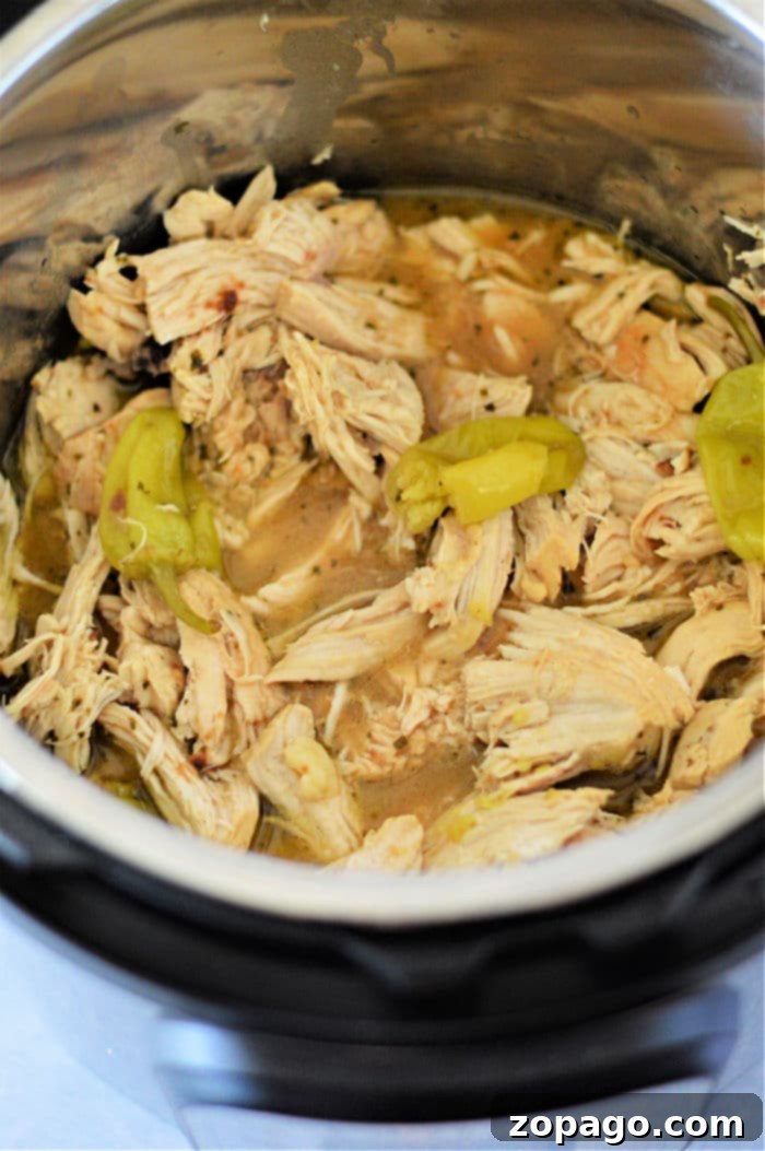 Instant Pot Mississippi Chicken: Flavor Fast 7 Delicious shredded chicken cooked in an Instant Pot, ready to be served.