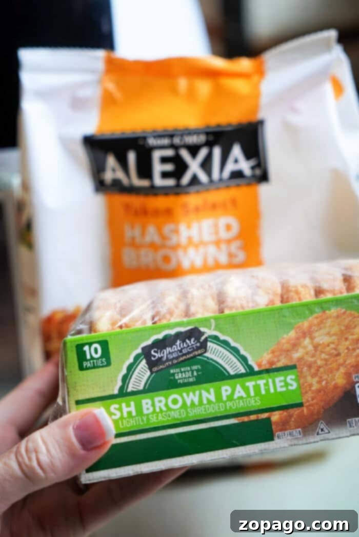 Perfectly Crispy Air Fryer Frozen Hash Browns 2 A close-up shot of a person holding a box of frozen hash brown patties next to a bag of shredded Alexia hash browns, ready for air frying.