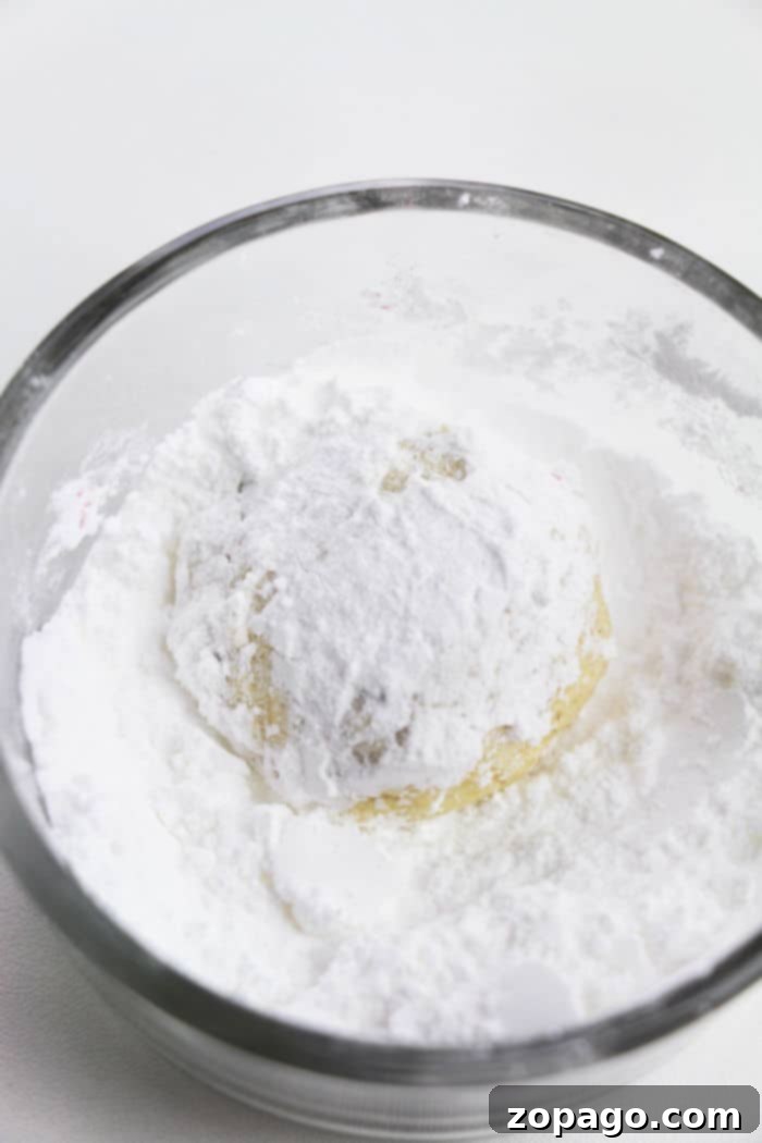 Three-Ingredient Cake Mix Cookie Magic 6 A tray of fresh cake mix cookies cooling on a rack, showcasing their soft texture.