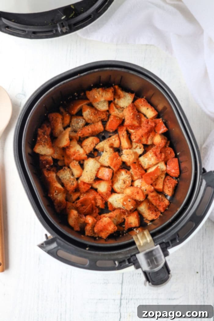 Ultimate Air Fryer Croutons 5 Ninja Foodi air fryer croutons being prepared, highlighting the versatility of different air fryer models.