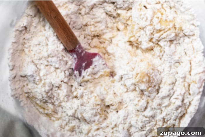 Tropical Coconut Muffins 5 Muffin batter with shredded coconut, ready for baking