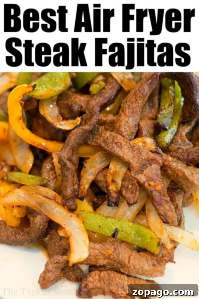 Perfect Air Fryer Beef 4 Close-up of cooked steak fajitas with green and yellow bell peppers and onions. The text above reads, "Best Air Fryer Steak Fajitas. Discover more delicious air fryer beef recipes today!