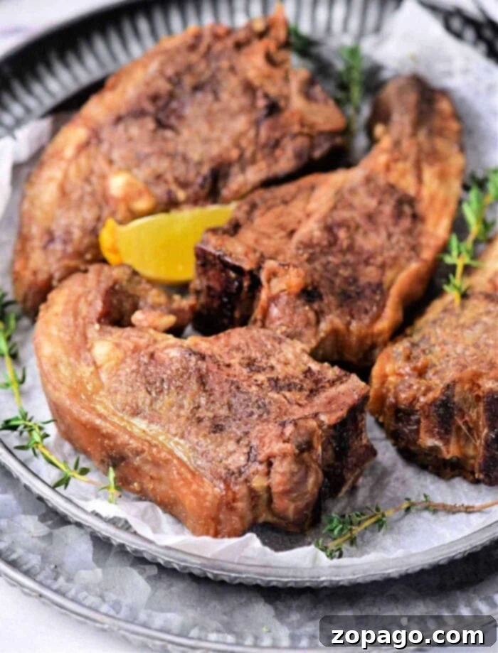 Perfect Air Fryer Lamb Chops 2 Air Fryer Lamb Chops, beautifully cooked and seasoned, ready to be served