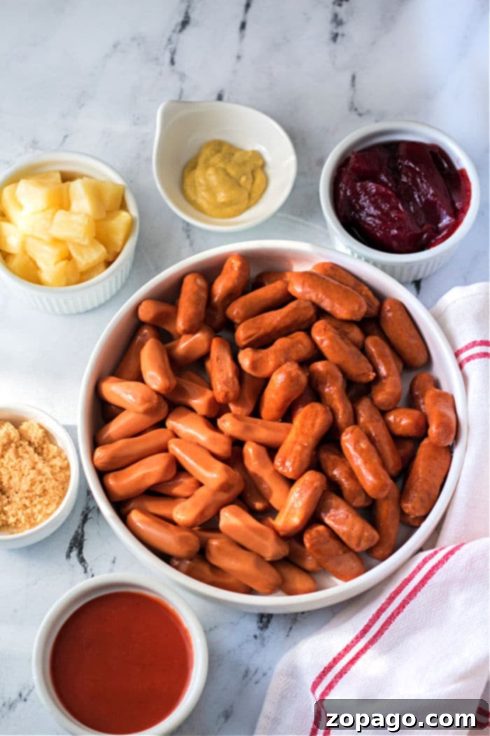 Sweet and Sticky Slow Cooker Sausages 3 little smokies recipe with sweet pineapple sauce
