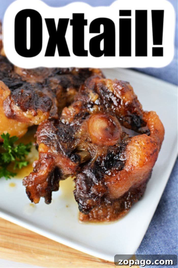 Fall Apart Slow Cooker Oxtail 9 Platter of perfectly cooked oxtail, glistening with rich sauce and ready to serve.