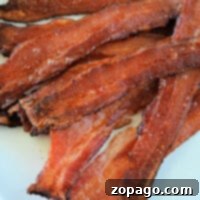 Perfect Bacon from the Freezer 7 A plate of crispy bacon strips, prepared from frozen, shows the satisfying result of mastering how to cook frozen bacon perfectly.