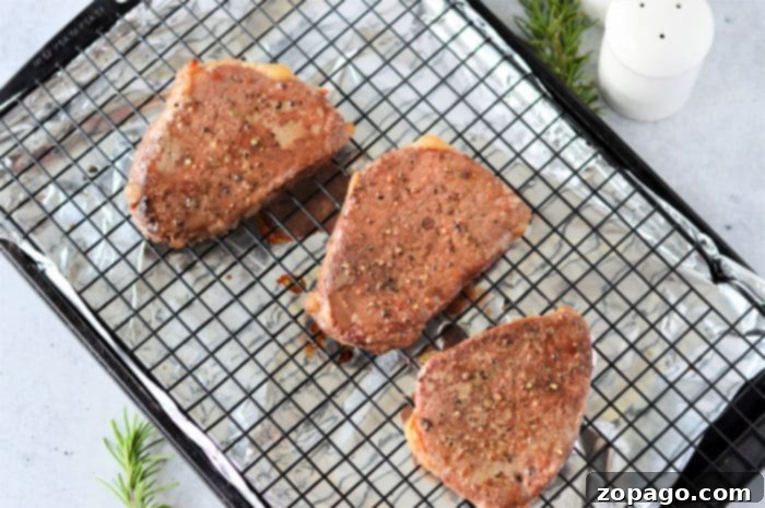 cooking frozen steaks - A skillet filled with olive oil, showing the perfect stage for searing frozen steaks to begin the cooking process.