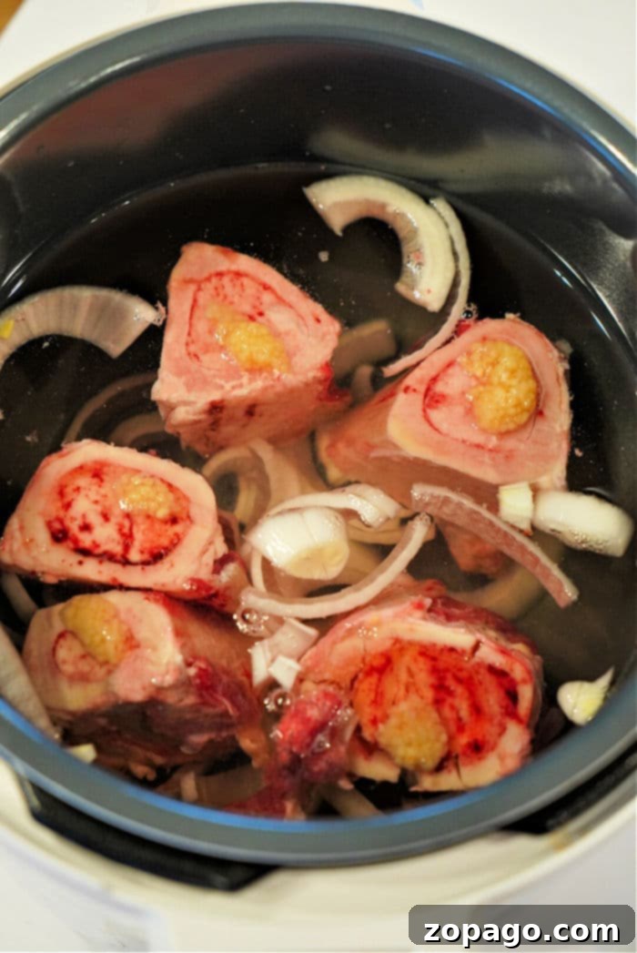 Beef Marrow Bones: Your Guide to Culinary Perfection 4 Cooked bone marrow being scooped out, ready to be served or used in other dishes.