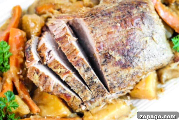 Slow Cooked Sirloin Tip Roast 6 Beef cooking gently in a slow cooker