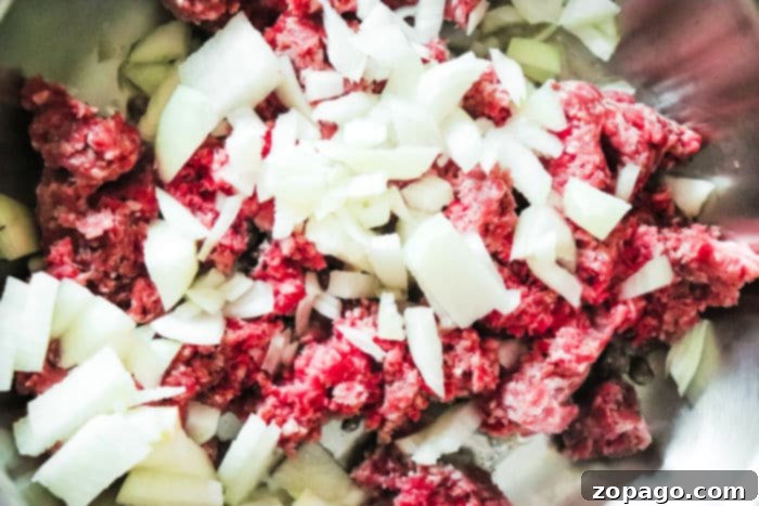 Effortless Slow Cooker Taco Meat 6 Flavorful taco meat simmering in a slow cooker, perfect for an easy family dinner or party spread.
