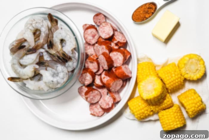 Easy Slow Cooker Shrimp Boil 4 Assortment of fresh ingredients for a shrimp boil: shrimp, corn, sausage, potatoes, and various spices.