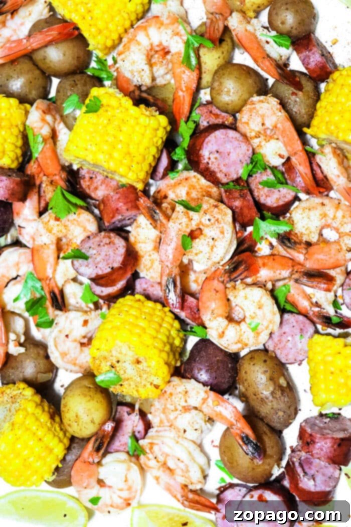 Easy Slow Cooker Shrimp Boil 6 A hearty Crockpot shrimp boil presented on a large platter with lemons, ready to be enjoyed.