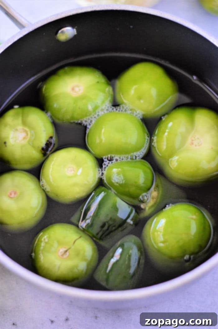 Unlocking the Flavor of Tomatillos 4 A close-up view of fresh, husked tomatillos, washed and ready for cooking, illustrating the simple preparation steps before boiling for salsa or other dishes.