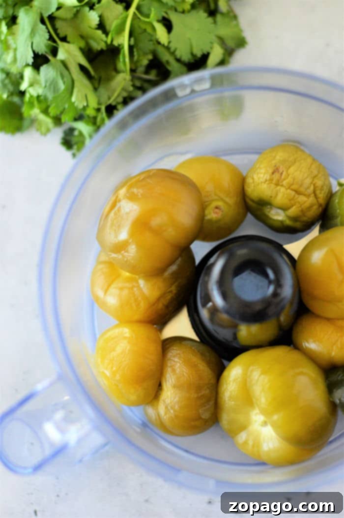 Unlocking the Flavor of Tomatillos 5 A vibrant bowl of freshly made tomatillo salsa, perfectly blended and ready to serve, showcasing the delicious outcome of properly cooked tomatillos.