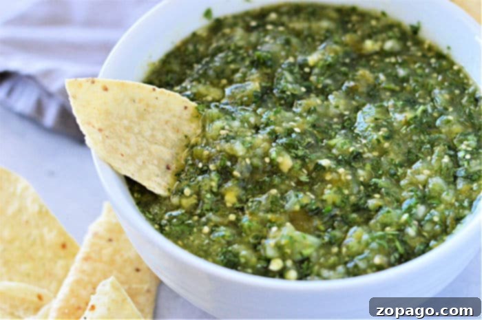 Unlocking the Flavor of Tomatillos 6 A close-up of vibrant homemade salsa verde, featuring a perfect consistency, ready to be enjoyed with chips or as an accompaniment to various Mexican dishes.