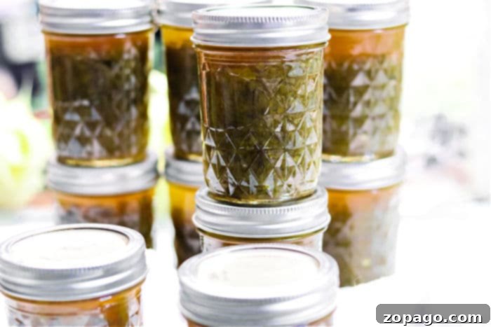 Crafting Qdoba's Signature Salsa Verde 6 Homemade Green Pepper Jelly with a vibrant green color.