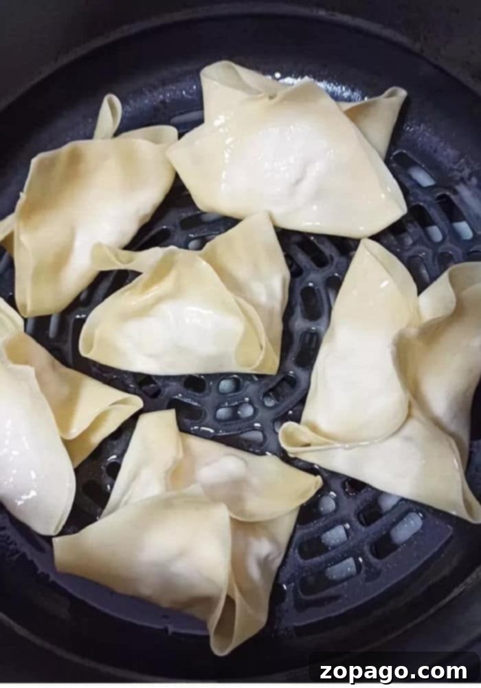 Crispy Air Fryer Ninja Foodi Crab Rangoon 4 Crab Rangoon filling in a bowl, showing the creamy texture and chopped imitation crab, ready to be stuffed into wrappers.